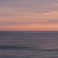 Sunset at the sea in purple and rose